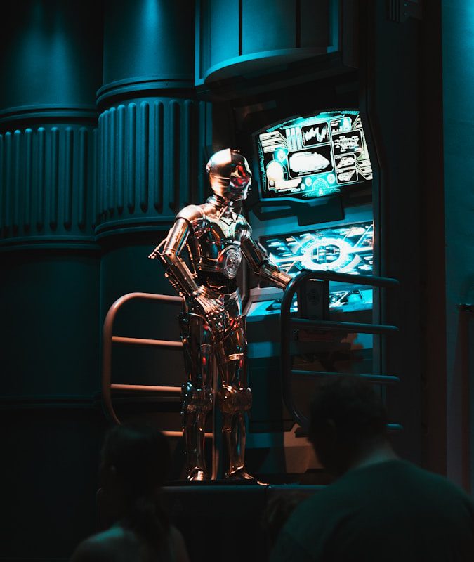 a man standing in front of a tv in a dark room